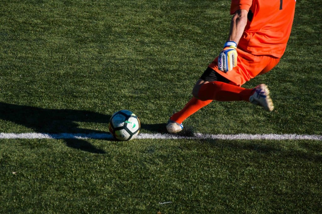 Kicking a football